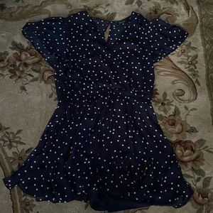 A blue poke a dot romper